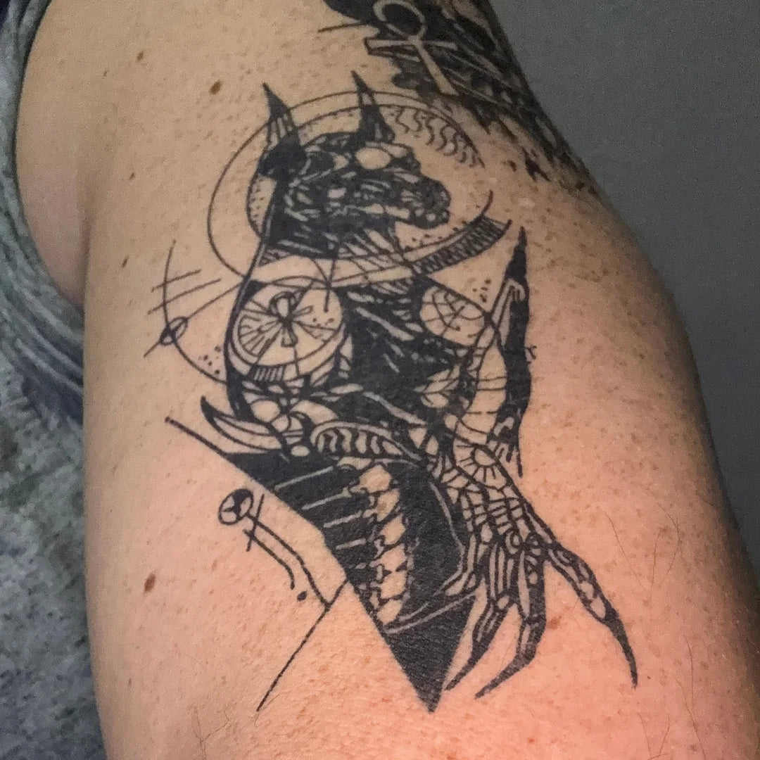 Anubis tattoo design on customer's arm