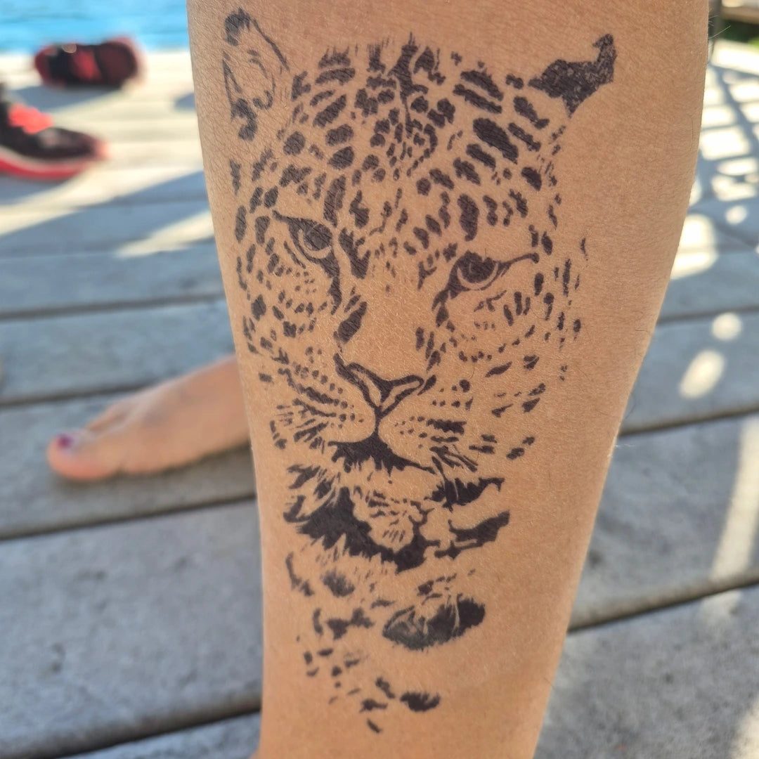 Real result of leopard semi-permanent tattoo on customer's calf